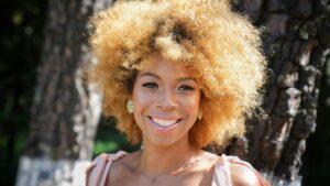 Smiling woman with curly red hair